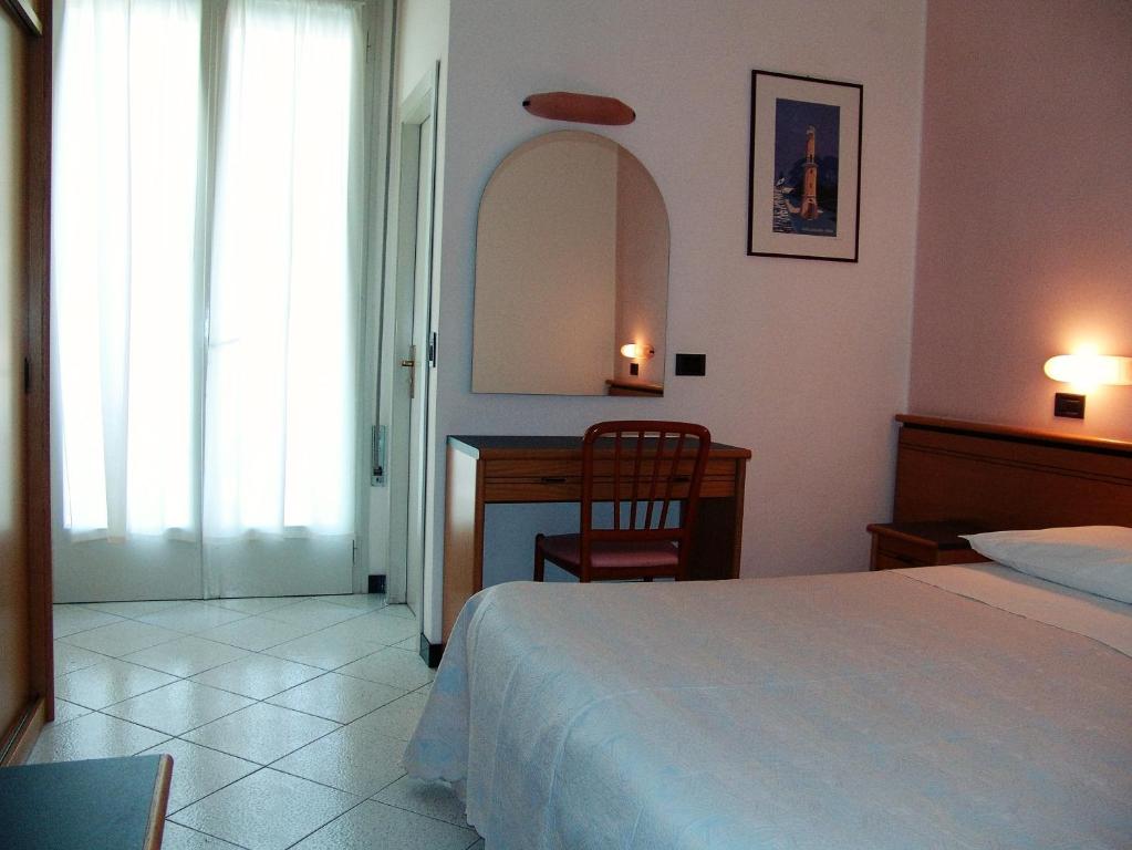 Posteľ alebo postele v izbe v ubytovaní Hotel Excelsior