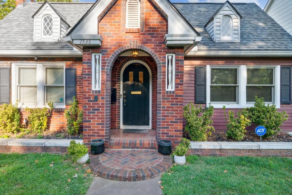 a red brick house with a black door at 3 Bed, Office, Hot Tub, 2 Min To Cherry St in Tulsa