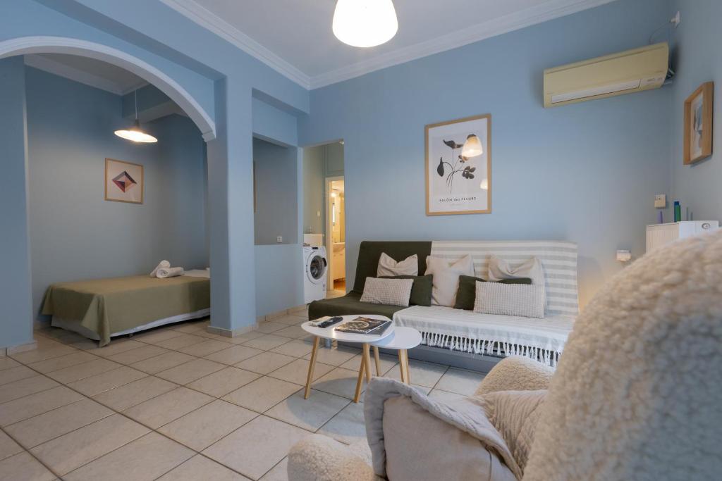 a living room with a bed and a couch at Casa di Mare Air-bnb in Nafpaktos