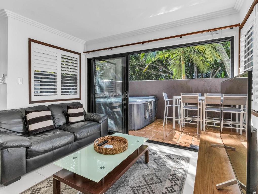 a living room with a couch and a table at Villas at Hastings Point by Kingscliff Accommodation in Hastings Point