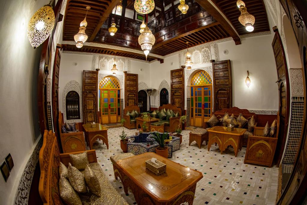 a view of a living room with a large room at Riad Hikaya - Fes Story in Fès