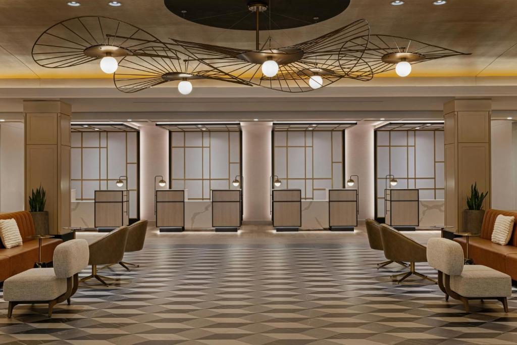 a waiting room with desks and chairs in a building at Sheraton Boston Hotel in Boston
