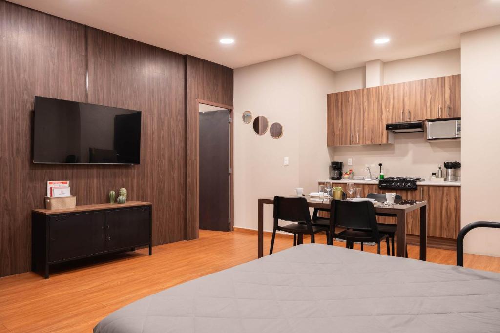 a living room with a kitchen and a dining room at 307 Spacious AC apt Historic CDMX Rooftop in Mexico City