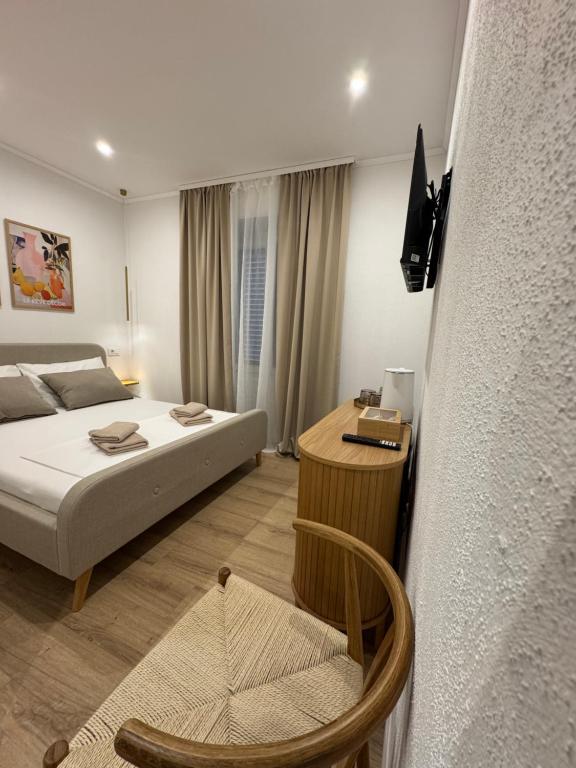 Ένα ή περισσότερα κρεβάτια σε δωμάτιο στο Pelješac Rooms