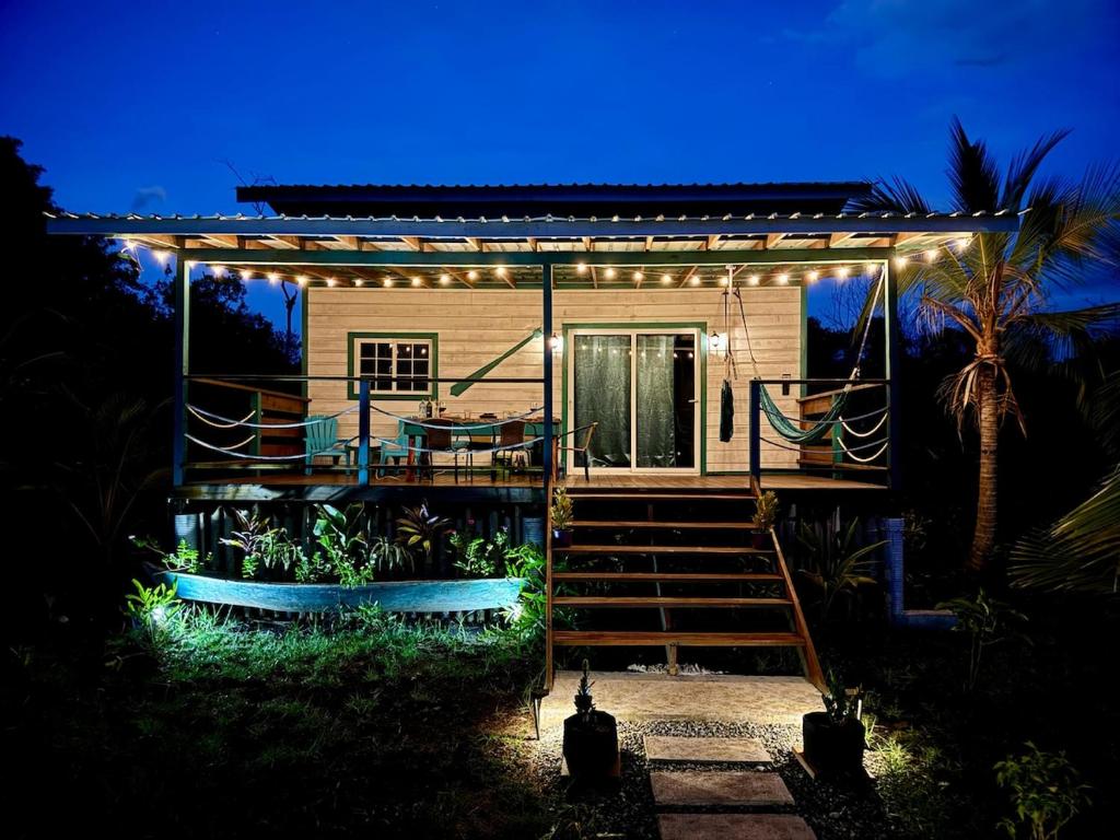 a house with a staircase leading to a house with lights at Big Bay Bocas - Casita Margarita 