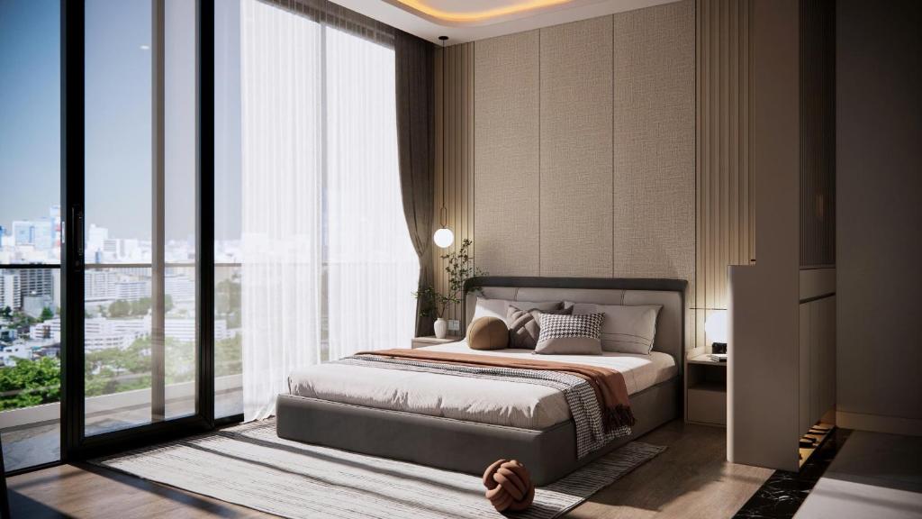 Giường trong phòng chung tại Petit Hotel