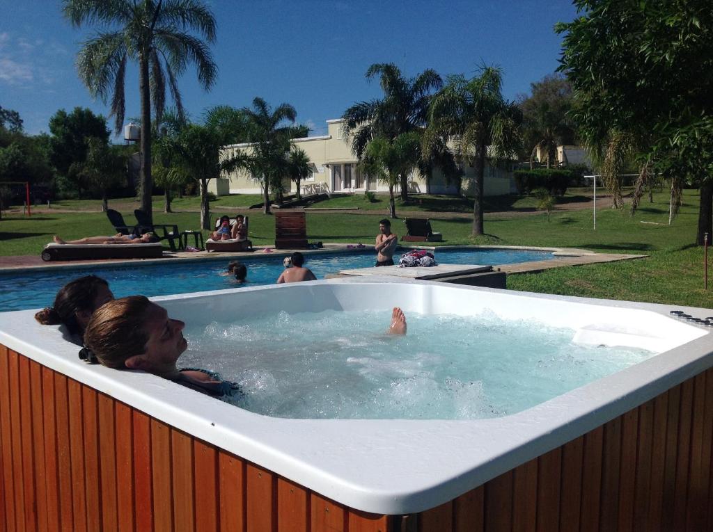 a group of people in a jacuzzi in a pool at Bungalows Mexico in Concepción del Uruguay