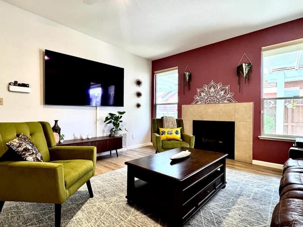 a living room with a couch and a fireplace at Modern Folsom Family Home Near Trails & Shopping in Folsom