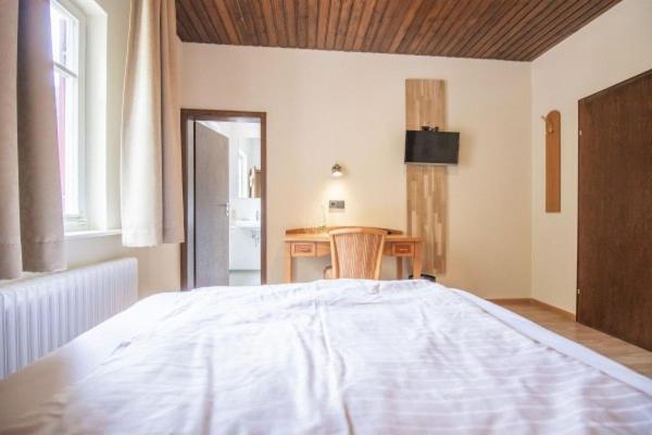 Postel nebo postele na pokoji v ubytování Hotel - Gasthof Blume