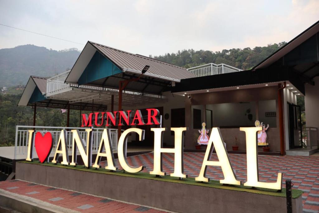a building with a sign that reads mama amariani at Rhythm Stays in Munnar