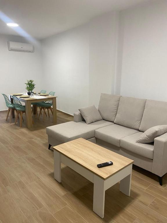 a living room with a couch and a table at PET FRIENDLY Casita Marín in Santa Pola