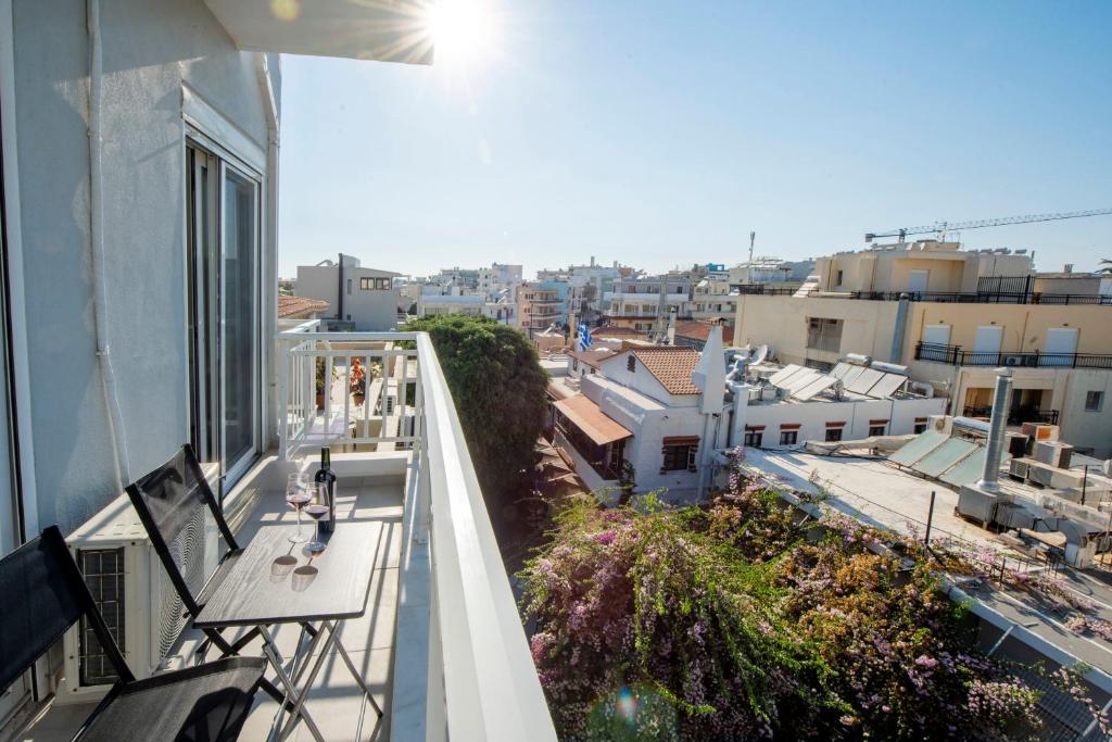 an apartment balcony with a view of a city at Mandilara Minimal Apartment in Rhodes Town