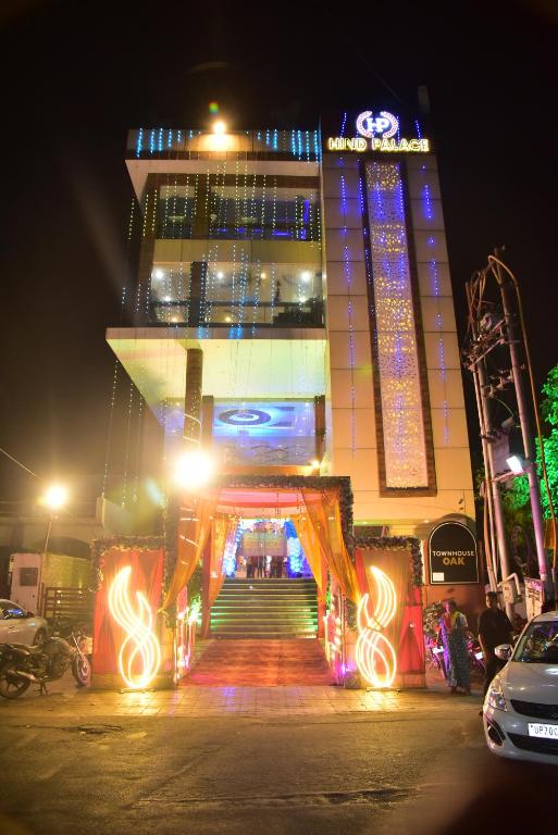 a large building with lights in front of it at night at Hind palace in Lucknow