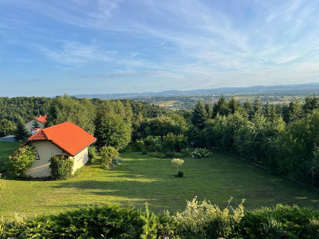 an aerial view of a garden with an orange roof at Domek pod Kamieńcem in Odrzykoń