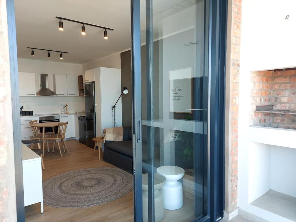 a view of a living room and kitchen from inside a house at 310 The Meadows in George