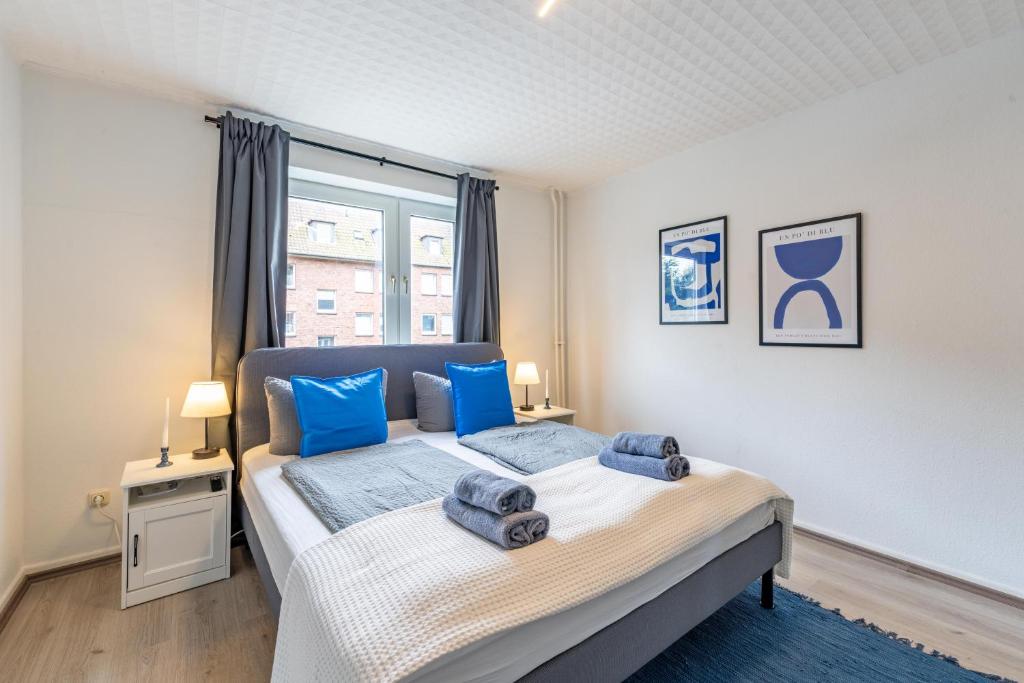 Ένα ή περισσότερα κρεβάτια σε δωμάτιο στο Apartmenthaus in Neumünster