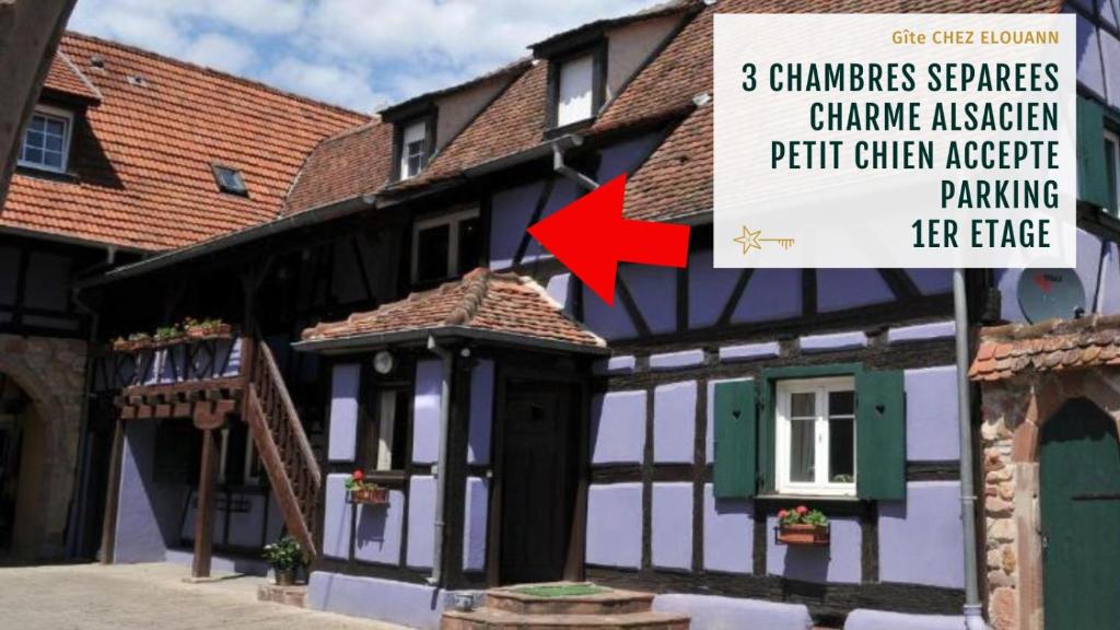 a building with a sign in front of it at Gîte Elouann familial spacieux calme in Ebersheim