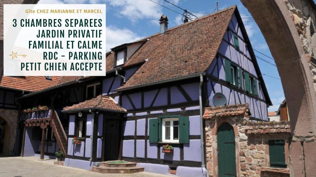 a building with a sign in front of it at Gîte Marcel et Marianne jardin et parking privatifs in Ebersheim