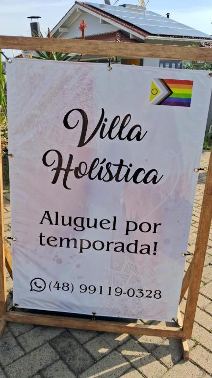 a sign that reads villa hosseinovoovo for tempretoria at Villa Holística in Nova Petrópolis