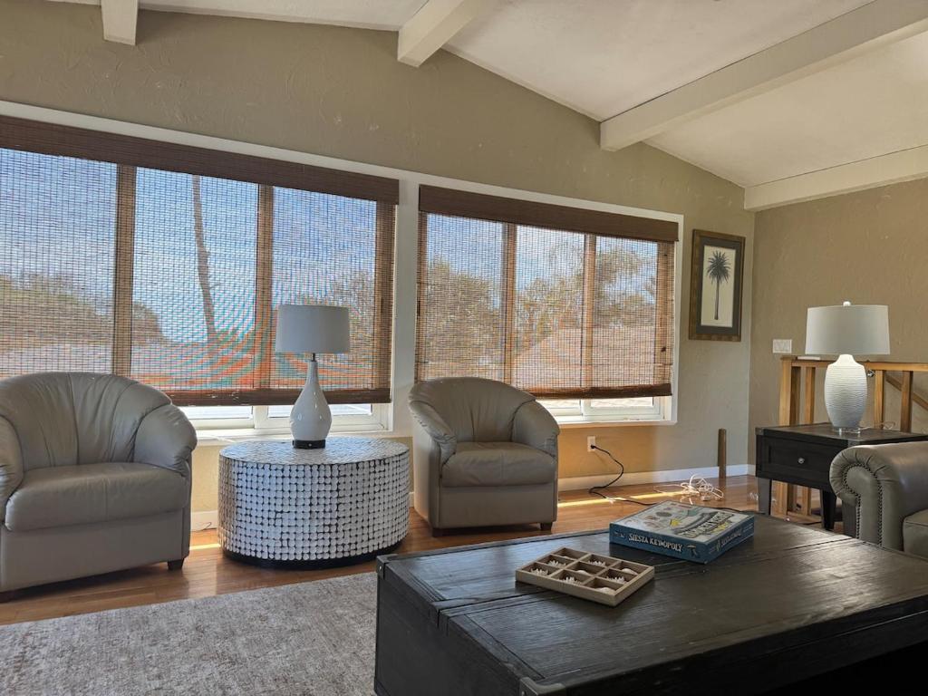 a living room with two chairs and a table at Canal Home Dearborn-Indian Mound in Englewood