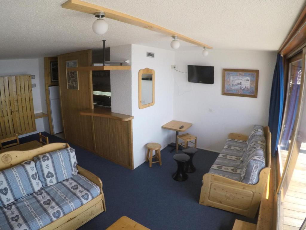 a room with two beds and a couch and a table at Résidence Nova 3 - Appartement 2 pièces 7 personnes proche des pistes MAE-7974 in Arc 1800