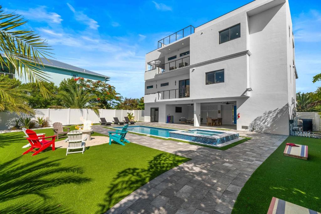 an image of a house with a swimming pool at Ocean Muse - Lux Waterfront Escape - Pool - Dock in Marathon