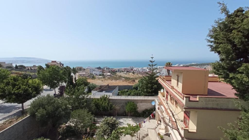a view of the ocean from a building at capuchino sanya in Tangier