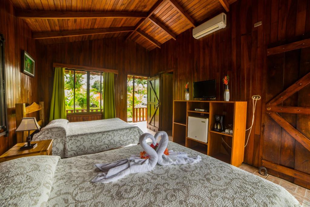Postel nebo postele na pokoji v ubytování Hotel Rancho Cerro Azul