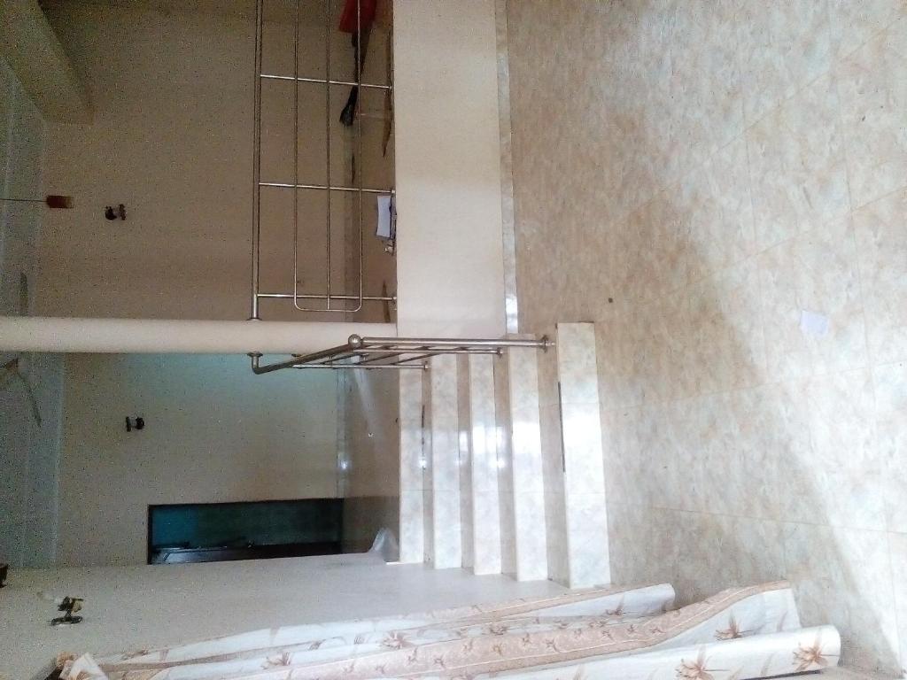 a light hanging from a ceiling in a room at THSVM Traveler in Nikawatawana