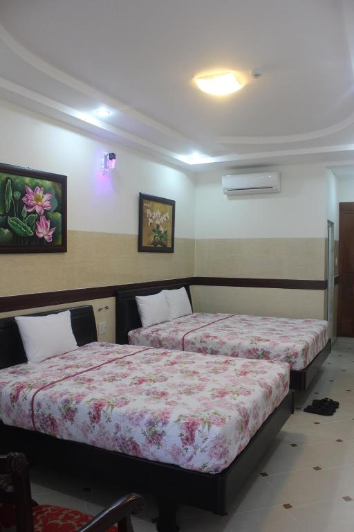 Postel nebo postele na pokoji v ubytování HOANG THANH THUY BÀ RỊA - VŨNG TÀU HOTEl 3