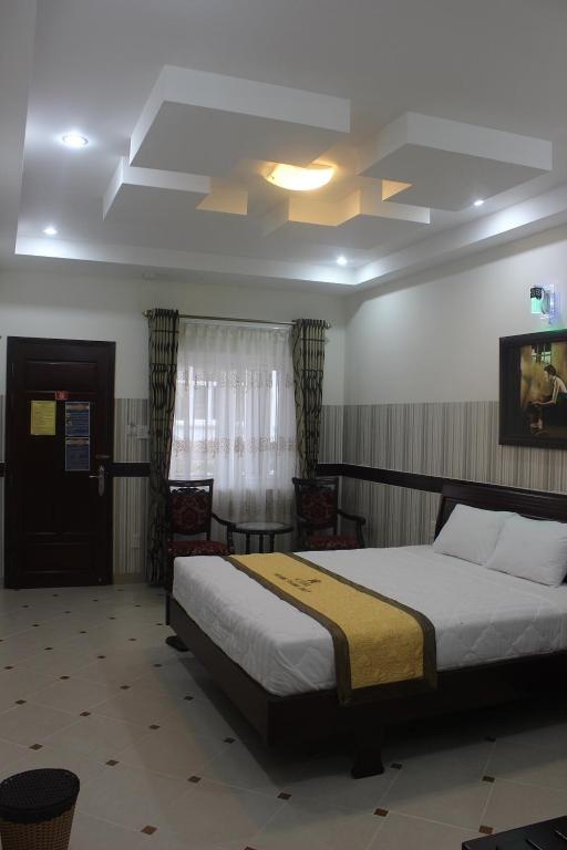 Postel nebo postele na pokoji v ubytování HOANG THANH THUY BÀ RỊA - VŨNG TÀU HOTEl 3