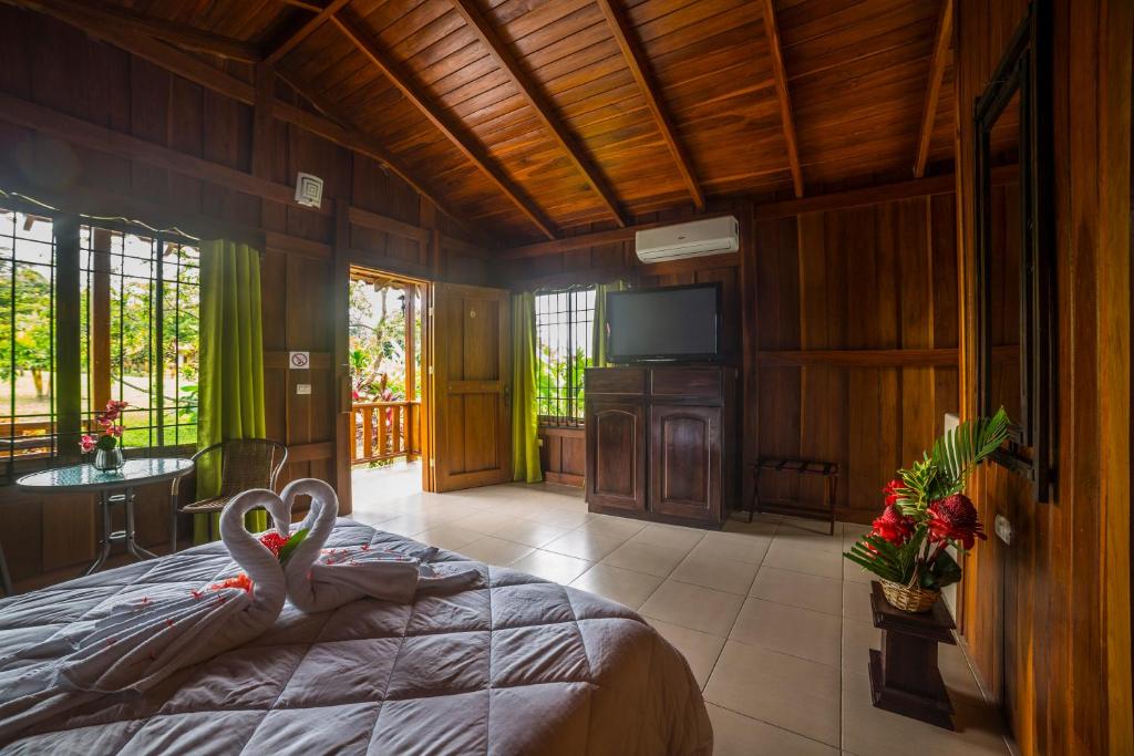 Postel nebo postele na pokoji v ubytování Hotel Rancho Cerro Azul