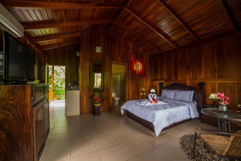 Postel nebo postele na pokoji v ubytování Hotel Rancho Cerro Azul
