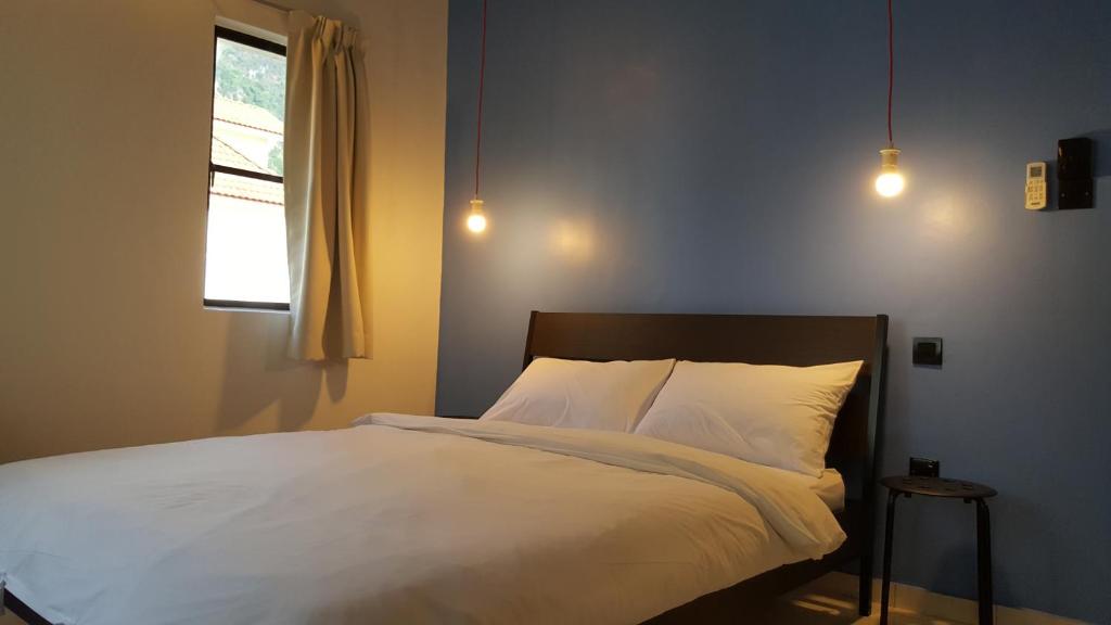 Postel nebo postele na pokoji v ubytování Tulip Hotel