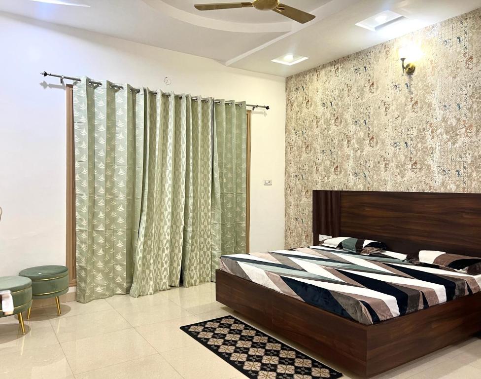 Postel nebo postele na pokoji v ubytování Bhaskar's Homestay