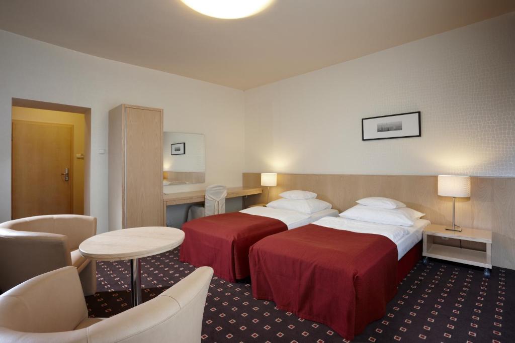 Postel nebo postele na pokoji v ubytování Hotel Laterum