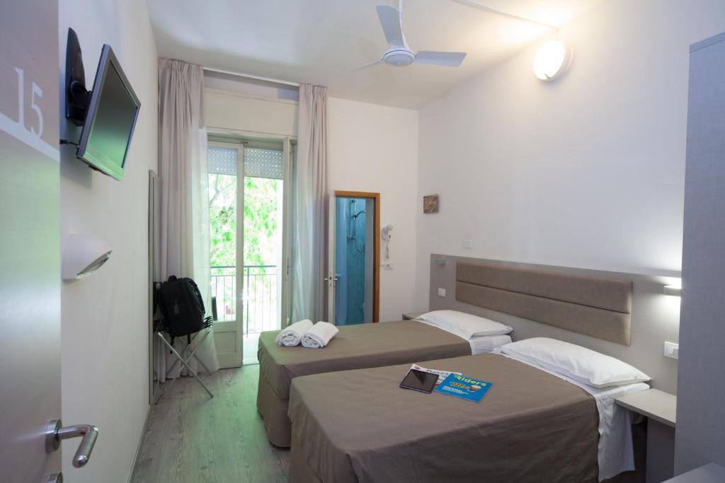 Postel nebo postele na pokoji v ubytování Hotel Lux