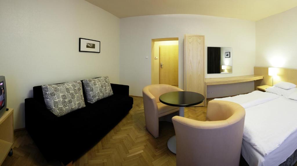 Postel nebo postele na pokoji v ubytování Hotel Laterum