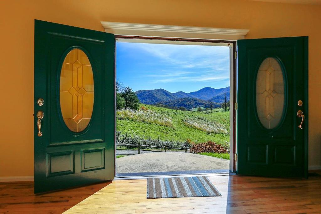 an open door with a view of a mountain at Close To Dt Asheville, Hot Tub, Pool Table in Weaverville