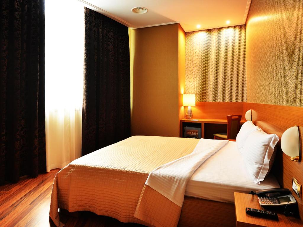 Postel nebo postele na pokoji v ubytování Hotel Austria