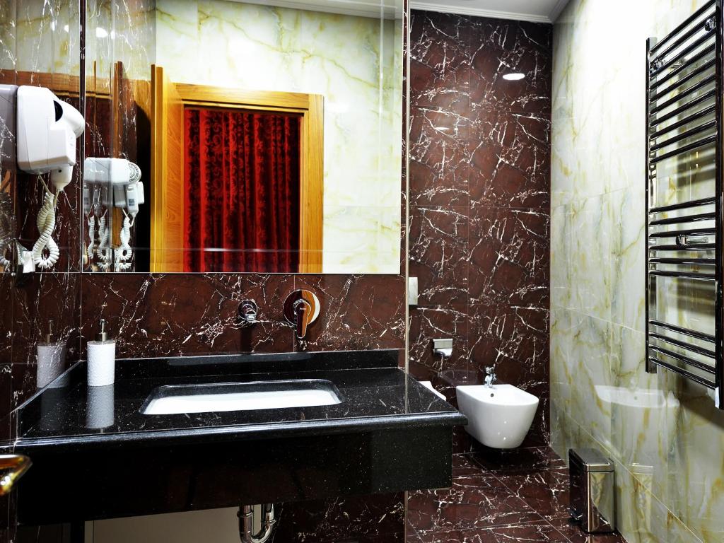 Koupelna v ubytování Hotel Austria