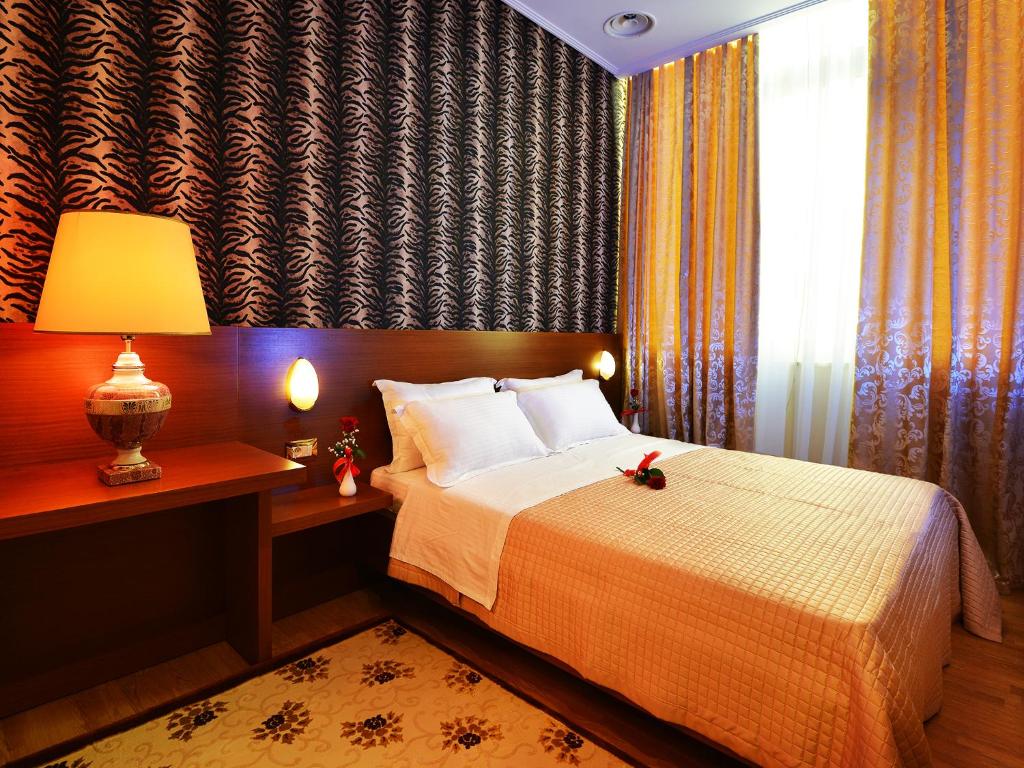 Postel nebo postele na pokoji v ubytování Hotel Austria