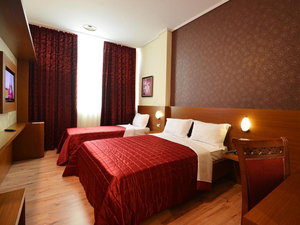 Postel nebo postele na pokoji v ubytování Hotel Austria