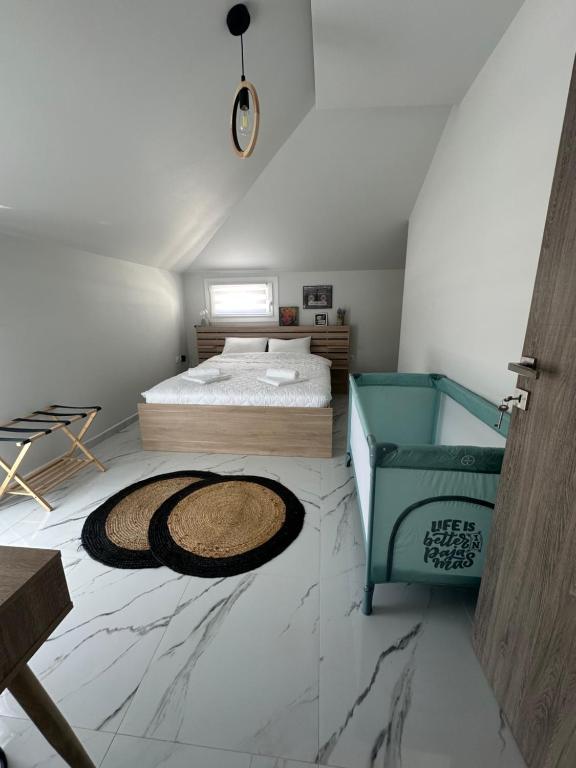 Ένα ή περισσότερα κρεβάτια σε δωμάτιο στο Fintirik Cozy Stay