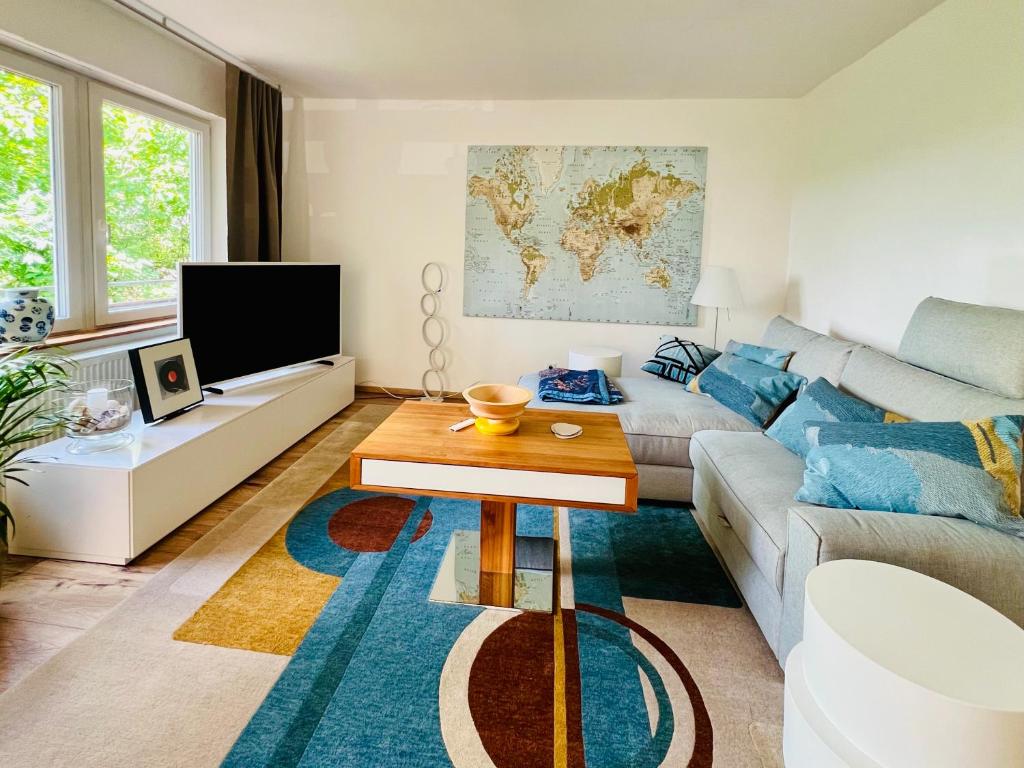a living room with a couch and a table at Ferienhaus Schott Prichsenstadt in Prichsenstadt