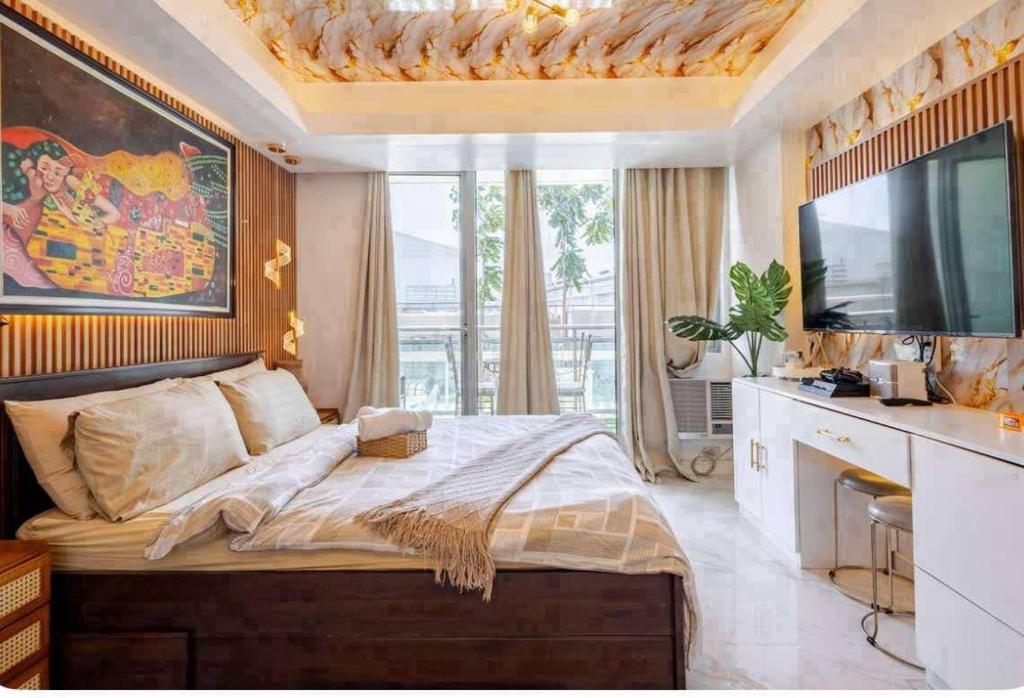 Ένα ή περισσότερα κρεβάτια σε δωμάτιο στο Homesweethome Beach Resort