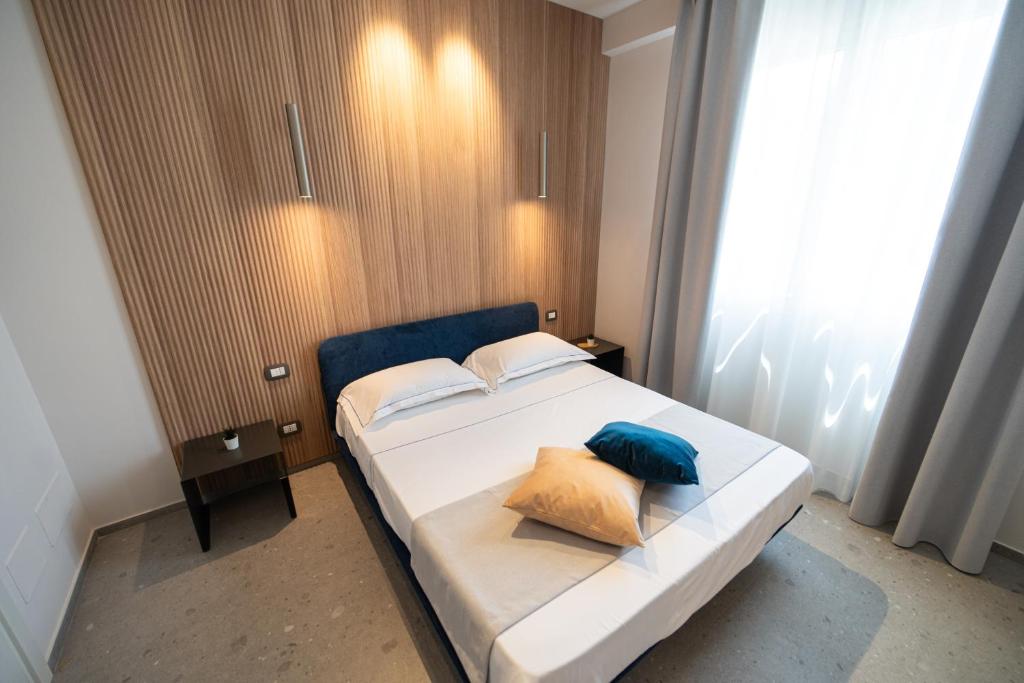 Ένα ή περισσότερα κρεβάτια σε δωμάτιο στο Aurora Blu - Comfort Rooms