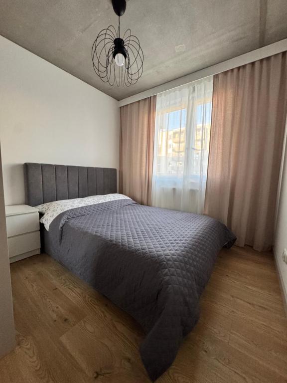 Postel nebo postele na pokoji v ubytování Piast Apartment - free parking