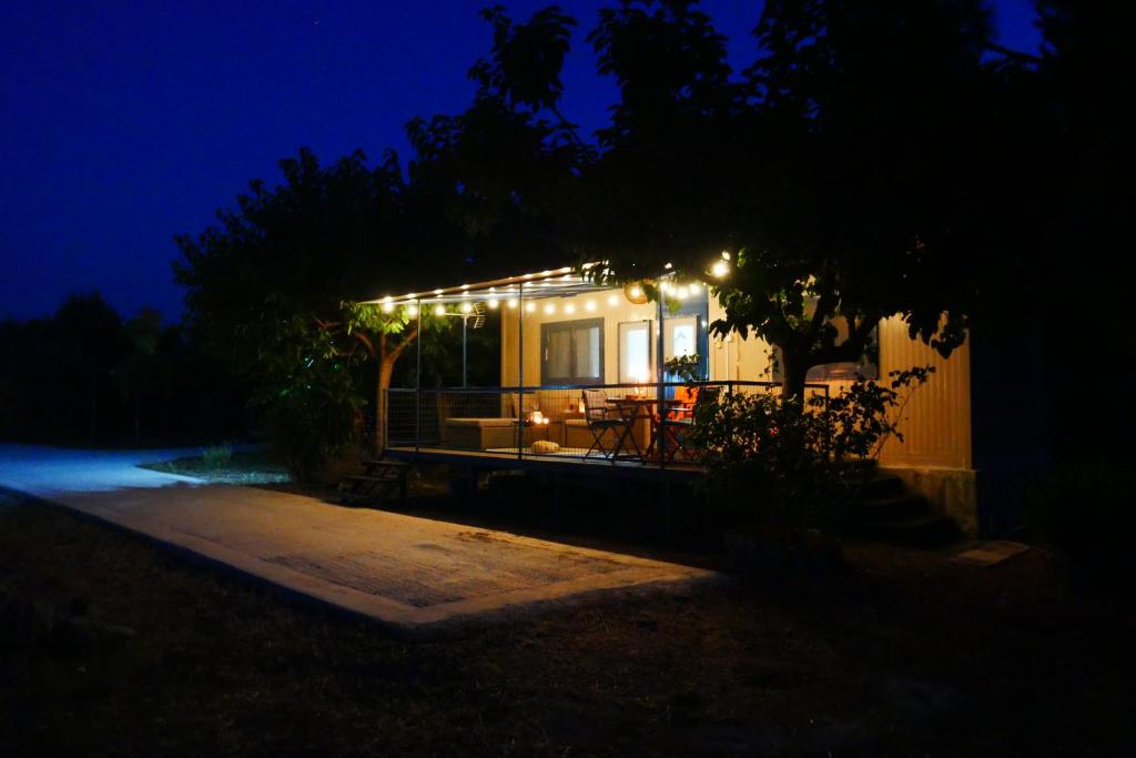 a small house with lights on it at night at Seaside Garden Galaxidi in Galaxidi