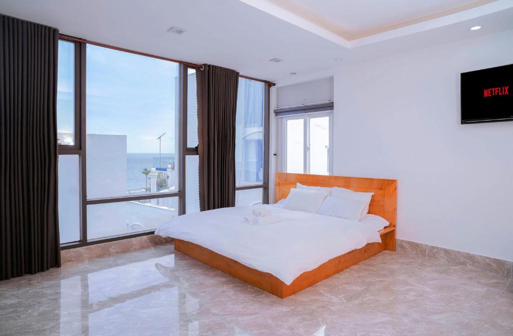 Ένα ή περισσότερα κρεβάτια σε δωμάτιο στο The July - Coliving by Kegotel